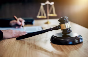 cropped image judge writing with gavel table 1048944 29908846